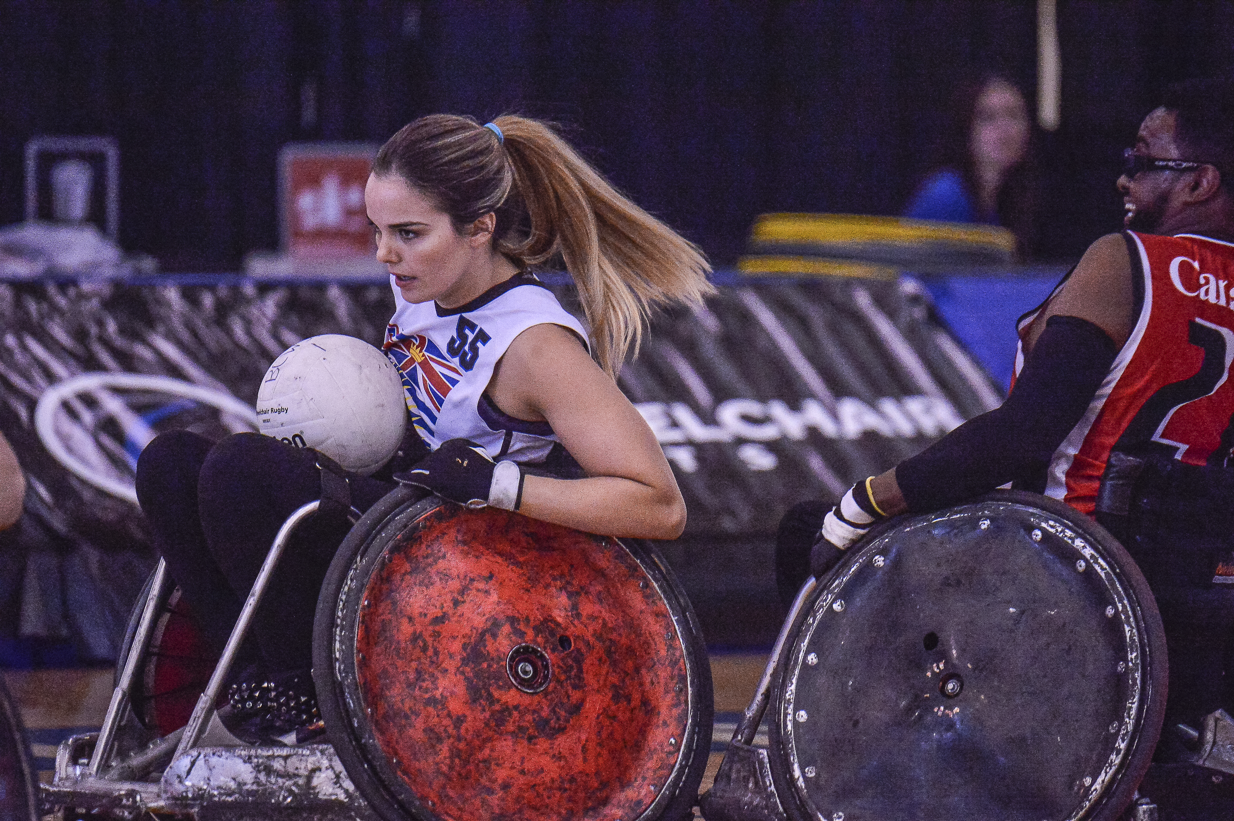 Women's Wheelchair Rugby player advancing her team
