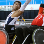 picture of two Wheelchair Rugby players going for the ball